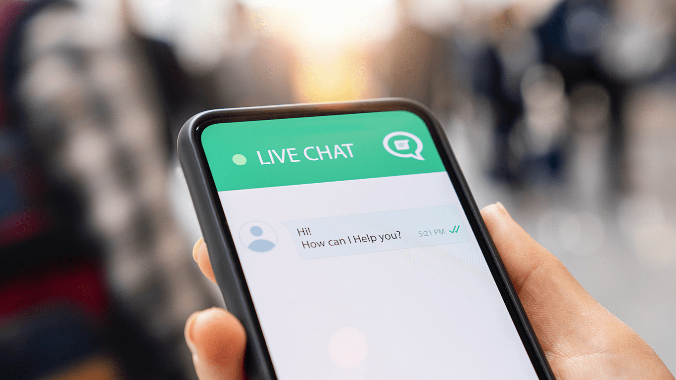 Smartphone screen displaying a live chat conversation with the message, "Hi! How can I help you?"