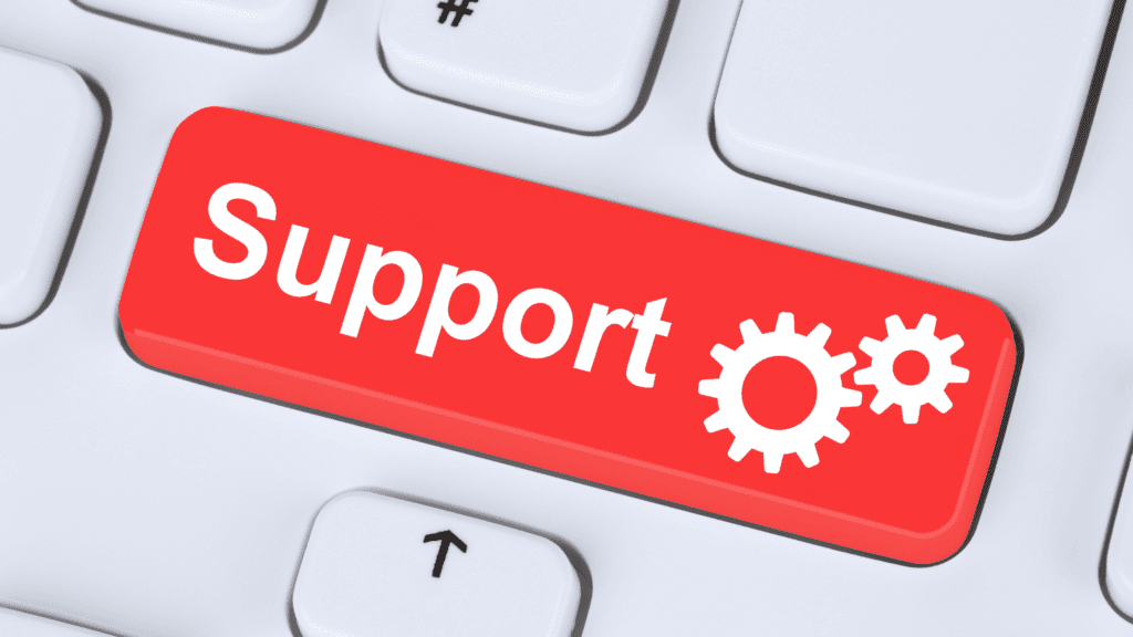 Red support button on a keyboard symbolising real-time multilingual customer service.