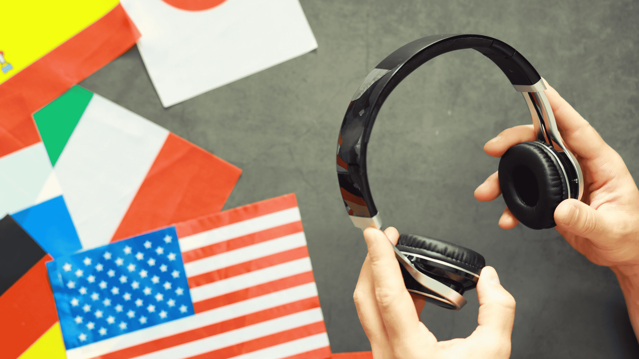 Headphones held above international flags, representing real-time multilingual customer service.