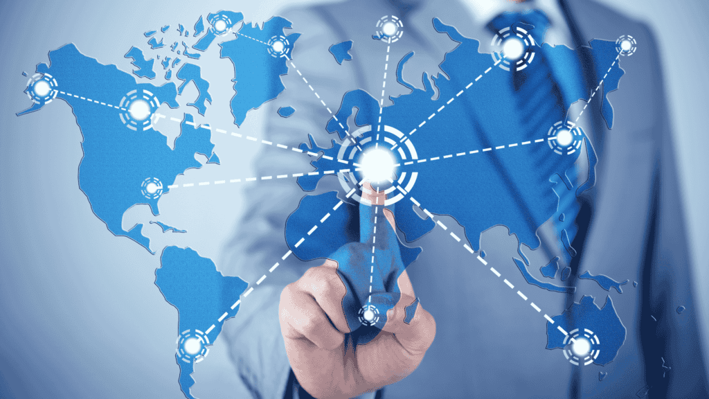 A business professional interacting with a digital world map displaying interconnected nodes and global connectivity