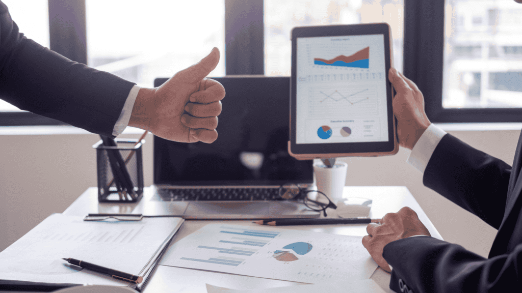 Business professionals analyzing customer care reports for continuous multilingual customer care improvements.