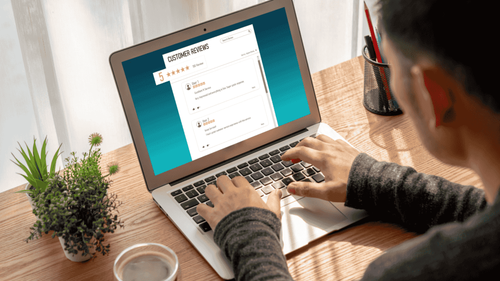 Person reviewing customer feedback on a laptop for a multilingual helpdesk service 24/7.