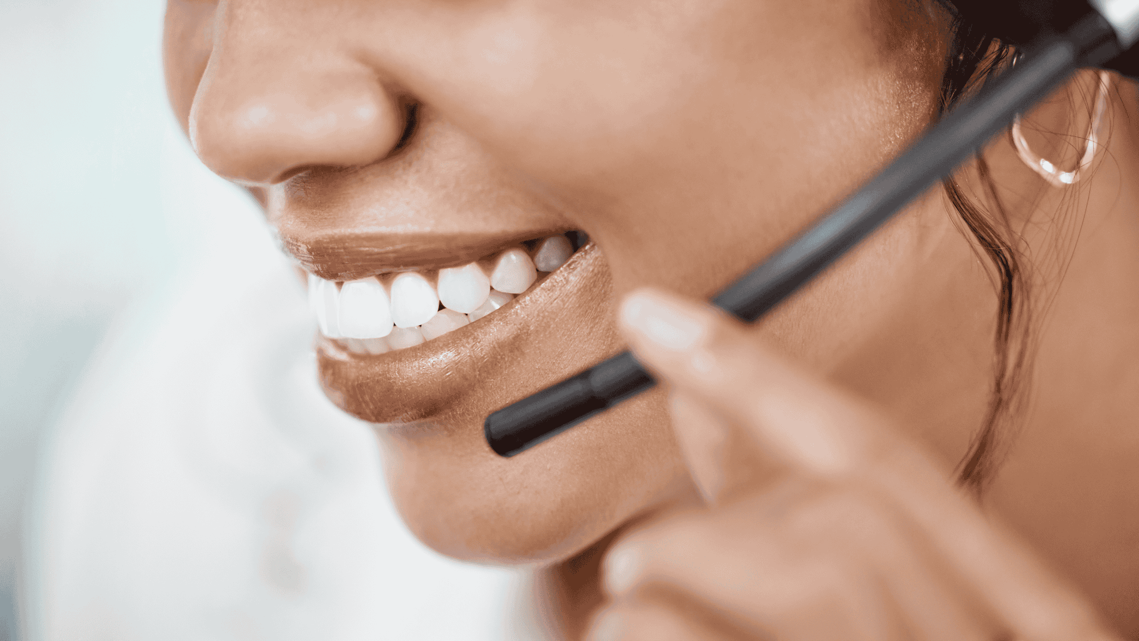 Close-up of a smiling customer support representative providing multilingual support services anytime.