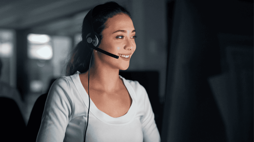 A dedicated customer support agent working during the night, emphasizing multilingual support services anytime.