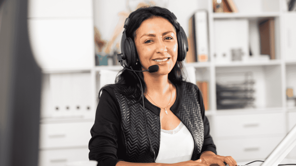 Smiling customer service representative providing nonstop multilingual customer support.