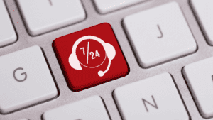 A red keyboard key with a headset icon and "24/7" text, representing round-the-clock customer support.
